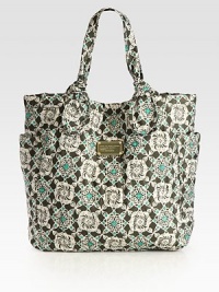 A whimsical print covers this carryall of sturdy nylon, with signature letter stitching and dual side pockets. Double top handles, 7 dropMagnetic snap closureTwo outside open pocketsOne inside zip pocketTwo inside open pocketsLogo-printed lining13W X 13½H X 4½DImported A whimsical print covers this carryall of sturdy nylon, with signature letter stitching and dual side pockets. Double top handles, 7 dropMagnetic snap closureTwo outside open pocketsOne inside zip pocketTwo inside open pocketsLogo-printed lining13W X 13½H X 4½DImported
