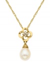 Make a stunning statement. This pendant, crafted from 10k gold, features a beautiful cultured freshwater pearl (8-10 mm) and diamond accents for a sparkling touch. Approximate length: 18 inches. Approximate drop: 9/10 inch.