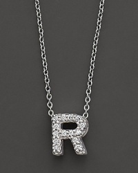 From the Tiny Treasures collection, a diamond R necklace. With signature ruby accent. Designed by Roberto Coin. From the Tiny Treasures collection, a diamond R necklace. With signature ruby accent. Designed by Roberto Coin.
