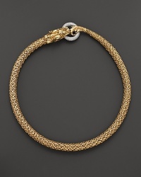 An 18K yellow gold dragon clasps a diamond pavé link in this striking necklace from John Hardy. An 18K yellow gold dragon clasps a diamond pavé link in this striking necklace from John Hardy.