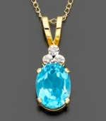Three sparkling, round-cut diamond accents sit atop a gleaming blue topaz stone (2 ct. t.w.) Set in 14k gold. Chain measures 18 inches; drop measures 3/4 inch.