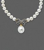 A sweet twist on an Audrey Hepburn classic. This 14k gold necklace of cultured freshwater pearls (10 mm) now incorporates a diamond-encrusted bow (1/4 ct. t.w.) and single hanging pearl pendant (12 mm). Approximate length: 17 inches. Approximate drop: 1 inch.