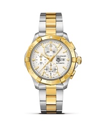 The Aquaracer from TAG Heuer features all six of TAG Heuer's features of a professional sports watch, including sapphire crystal, luminescent markers, screw-in crown, unidirectional rotating bezel, a double safety clasp and 300M water resistance. The Calibre 16 automatic chronograph movement features 3 subdials and a date window. This model features 18K. gold and steel. The Aquaracer from TAG Heuer features all six of TAG Heuer's features of a professional sports watch, including sapphire crystal, luminescent markers, screw-in crown, unidirectional rotating bezel, a double safety clasp and 300M water resistance. The Calibre 16 automatic chronograph movement features 3 subdials and a date window. This model features 18K. gold and steel.