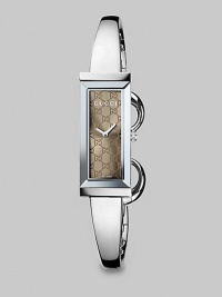 From the G-Frame Collection. A sophisticated bangle with a brown GG pattern dial and a stainless steel case. Swiss quartz movementWater resistant to 3 ATMRectangular stainless steel case, 14mm (0.5) X 34mm (1.3)Smooth bezelBrown GG pattern dialStainless steel bangleMade in Switzerland From the G-Frame Collection. A sophisticated bangle with a brown GG pattern dial and a stainless steel case. Swiss quartz movementWater resistant to 3 ATMRectangular stainless steel case, 14mm (0.5) X 34mm (1.3)Smooth bezelBrown GG pattern dialStainless steel bangleMade in Switzerland