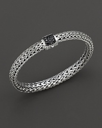 Small signature sterling woven chain bracelet with carved chain black sapphire clasp, designed by John Hardy. Small signature sterling woven chain bracelet with carved chain black sapphire clasp, designed by John Hardy.