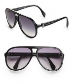 An edgy acetate design with Swarovski crystal embellished skull details at the temples. Available in black with gray gradient lens. Logo temples 100% UV protection Made in Italy 