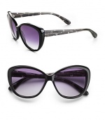 Large retro plastic design. Available in black/black check with gray gradient lens or havana pearl peach with brown gradient lens. Logo temples 100% UV protection Imported 