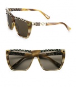 Slither into a statement style with this snake-print leather accented resin design. Available in shiny horn with brown lens or shiny bordeaux with brown gradient lens. Snake-printed leather accented rims and temples100% UV protectionMade in Italy 
