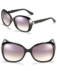 Circular detail at temples add an edgy style to these glamorous oversized sunglasses from MARC BY MARC JACOBS. Circular detail at temples add an edgy style to these glamorous oversized sunglasses from MARC BY MARC JACOBS.