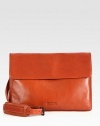 A smart, streamlined shoulder bag is incredibly versatile with interior slip pockets to organize all of your day-to-day essentials and an adjustable shoulder strap for maximum comfort.Flap closureAdjustable shoulder strapInterior slip pocketsFully linedLeather15W x 12H x 1DImported
