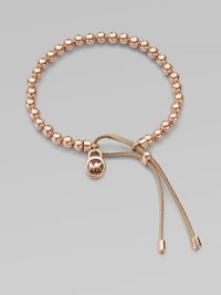 A smooth, beaded design with a logo lock charm and an adjustable leather closure. Rose goldtone metalDiameter, about 2.5Slip-on style with adjustable leather closureImported A smooth, beaded design with a logo lock charm and an adjustable leather closure. Rose goldtone metalDiameter, about 2.5Slip-on style with adjustable leather closureImported