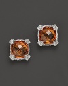 Brilliant honey corundum is framed in sterling silver on these timeless Judith Ripka studs.
