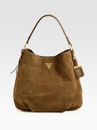 Classic suede hobo design with front goldtone logo.Shoulder strap, 7½ dropMagnetic snap closureProtective metal feetOne inside zip pocketThree inside open pocketsSignature jacquard lining15½W X 13½H X 4¼DMade in Italy