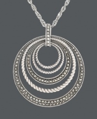 For stellar style and a hint of sparkle -- simply add a little Genevieve & Grace! This chic, orbital pendant features graduated circles that cause a stir with rope edging and glittering marcasite accents. Crafted in sterling silver. Approximate length: 18 inches. Approximate drop: 2-1/8 inches. For stellar style and a hint of sparkle -- simply add a little Genevieve & Grace! This chic, orbital pendant features graduated circles that cause a stir with rope edging and glittering marcasite accents. Crafted in sterling silver. Approximate length: 18 inches. Approximate drop: 2-1/8 inches.