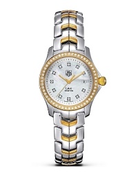 With its unique design, the TAG Heuer Link series has represented a perfect balance of sport and prestige since 1999. Its architecture reflects the power and beauty of steel through the play of contrasts and its refined lines. White mother-of-pearl dial with 11 diamonds and a polished 52 diamond accented 18 Kt. gold bezel. Features a date window. With its unique design, the TAG Heuer Link series has represented a perfect balance of sport and prestige since 1999. Its architecture reflects the power and beauty of steel through the play of contrasts and its refined lines. White mother-of-pearl dial with 11 diamonds and a polished 52 diamond accented 18 Kt. gold bezel. Features a date window.