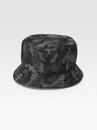 A bucket silhouette in camouflaged nylon with tonal colors and contemporary appeal. Stitched brim Made in Italy A bucket silhouette in camouflaged nylon with tonal colors and contemporary appeal. Stitched brim Made in Italy