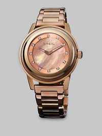 From the Orchestra Collection. A statement style in a modern rose gold color with dazzling Swarovski crystal markers. Quartz movementWater resistant to 10 ATMRound rose goldtone ion-plated stainless steel case, 40mm (1.5) Multi-layered bezelRose mother-of-pearl dialSwarovski crystal markersRose goldtone ion-plated stainless steel link braceletImported From the Orchestra Collection. A statement style in a modern rose gold color with dazzling Swarovski crystal markers. Quartz movementWater resistant to 10 ATMRound rose goldtone ion-plated stainless steel case, 40mm (1.5) Multi-layered bezelRose mother-of-pearl dialSwarovski crystal markersRose goldtone ion-plated stainless steel link braceletImported