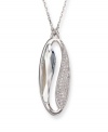 Make a statement of harmony and purity. Swarovski's silver tone mixed metal pendant is inspired by the Yin and Yang. The lightness of the large faceted azure Swarovski crystal contrasts with the clear crystals in a pavé setting, providing a harmonious mix of glitter and gleam. Approximate length: 19 inches. Approximate drop: 1-1/4 inches.