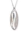 Make a statement of harmony and purity. Swarovski's silver tone mixed metal pendant is inspired by the Yin and Yang. The lightness of the large faceted azure Swarovski crystal contrasts with the clear crystals in a pavé setting, providing a harmonious mix of glitter and gleam. Approximate length: 19 inches. Approximate drop: 1-1/4 inches.