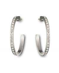 Keep your options open with Swarovski's open hoop crystal earrings. Whether you choose to wear them for daytime or evening, their subtle sparkle will make a stunning impact. Crafted in silver tone mixed metal. Approximate diameter: 2 inches. Keep your options open with Swarovski's open hoop crystal earrings. Whether you choose to wear them for daytime or evening, their subtle sparkle will make a stunning impact. Crafted in silver tone mixed metal. Approximate diameter: 2 inches.