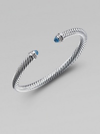 From the Color Classic Collection. A signature Yurman cable of sterling silver, richly enhanced by bands of pavé diamonds encircling blue topaz end caps. Diamonds, .09 tcw Blue topaz Sterling silver Width, 5mm Diameter, about 2½ Made in USA From the Color Classic Collection. A signature Yurman cable of sterling silver, richly enhanced by bands of pavé diamonds encircling blue topaz end caps. Diamonds, .09 tcw Blue topaz Sterling silver Width, 5mm Diameter, about 2½ Made in USA
