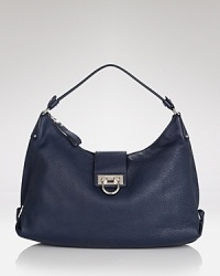 A new essential: this Salvatore Ferragamo defines new season ease with its effortless over-the-shoulder shape and elegant Gancini hardware. A new essential: this Salvatore Ferragamo defines new season ease with its effortless over-the-shoulder shape and elegant Gancini hardware.