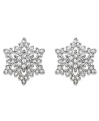 Delicate and refined -- Swarovski's sparkling stud earrings feature a pretty snowflake-shaped silhouette. Crafted in silver tone mixed metal with sparkling crystal pavé. Approximate diameter: 1 inch. Delicate and refined -- Swarovski's sparkling stud earrings feature a pretty snowflake-shaped silhouette. Crafted in silver tone mixed metal with sparkling crystal pavé. Approximate diameter: 1 inch.