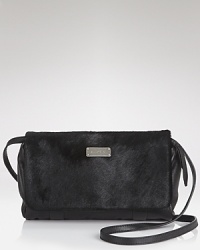 Small scale yet statement-making. See by Chloé sized-down clutch is a cool desk-to-dinner companion with textured leather and a versatile shoulder strap. Small scale yet statement-making. See by Chloé sized-down clutch is a cool desk-to-dinner companion with textured leather and a versatile shoulder strap.
