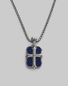 An original design pairs two sterling silver pendants on a single strand. The cross pendant is crafted with pavé diamond detail, and the larger features smooth lapis inlay. Sterling silver Pavé diamonds Lapis Pendant: 1 long Necklace: 24 long Lobster clasp closure Imported 
