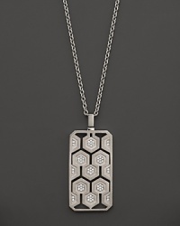 An eye-catching geometric pattern and brilliant diamonds captivate in this sterling silver dog tag necklace from India Hicks. An eye-catching geometric pattern and brilliant diamonds captivate in this sterling silver dog tag necklace from India Hicks.