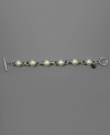 Dabble in dainty style with this beautiful bracelet by AK Anne Klein featuring glass pearls set in silvertone mixed metal. Approximate length: 7-1/2 inches.
