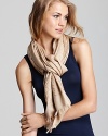 Decorated by a jacquard pattern of iconic Ts, this beautiful Tory Burch scarf channels stay-warm style.