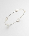 From the Scultura Collection. Five mother-of-pearl cabochon stations set in a sleek sterling silver bangle. Mother-of-pearlSterling silverDiameter, about 2.5Slip-on styleImported 