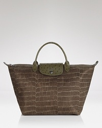 Lonchamp's croc-embossed Le Pliage handbag shows off with ostrich-embossed accents. Lonchamp's croc-embossed Le Pliage handbag shows off with ostrich-embossed accents.
