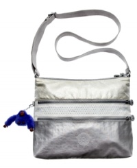 Glimmer is good, especially when it comes to this ultra-mod, metallic crossbody by Kipling. Made from water-resistant Denier nylon for rugged durability and decked out in shiny silver-tone hardware, it's the perfect marriage of fashion and function. Glimmer is good, especially when it comes to this ultra-mod, metallic crossbody by Kipling. Made from water-resistant Denier nylon for rugged durability and decked out in shiny silver-tone hardware, it's the perfect marriage of fashion and function.