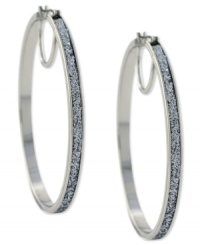 Hit the right notes with these hoop earrings from Jessica Simpson. Crafted from silver tone mixed metal, they also shine with silver glitter. Approximate drop: 2-1/2 inches. Approximate diameter: 2-1/2 inches. Hit the right notes with these hoop earrings from Jessica Simpson. Crafted from silver tone mixed metal, they also shine with silver glitter. Approximate drop: 2-1/2 inches. Approximate diameter: 2-1/2 inches.
