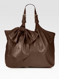 An incredibly roomy silhouette of supple calfskin, shaped by an oversized top bow.Adjustable shoulder straps, 10-12 dropSnap closureInner zip pocket18W X 11H X 3¾DMade in Italy An incredibly roomy silhouette of supple calfskin, shaped by an oversized top bow.Adjustable shoulder straps, 10-12 dropSnap closureInner zip pocket18W X 11H X 3¾DMade in Italy
