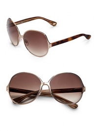 THE LOOKMetal round style Etched logo on lens Logo accented temples UVA and UVB protectionSignature case includedTHE COLORGold with gradient brown lensesORIGINMade in Italy THE LOOKMetal round style Etched logo on lens Logo accented temples UVA and UVB protectionSignature case includedTHE COLORGold with gradient brown lensesORIGINMade in Italy