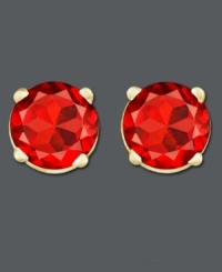 Add a touch of red-hot color to your wardrobe. Earrings feature round-cut garnets (1-1/10 ct. t.w.) in a 14k gold post setting. Approximate diameter: 1/4 inch. Add a touch of red-hot color to your wardrobe. Earrings feature round-cut garnets (1-1/10 ct. t.w.) in a 14k gold post setting. Approximate diameter: 1/4 inch.