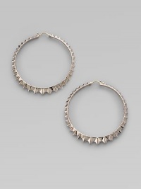 A classic hoop design in sterling silver, distinguished by a faceted zigzag pattern all around. Sterling silver Diameter, about 2½ Pierced Imported A classic hoop design in sterling silver, distinguished by a faceted zigzag pattern all around. Sterling silver Diameter, about 2½ Pierced Imported