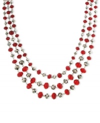 Look resplendent in red. This three-strand necklace from 2028 is crafted from mixed metal with red beads and glass crystals for a stunning look. Approximate length: 16 inches + 3-inch extender. Look resplendent in red. This three-strand necklace from 2028 is crafted from mixed metal with red beads and glass crystals for a stunning look. Approximate length: 16 inches + 3-inch extender.