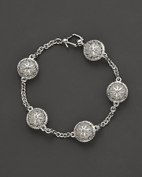 Inspired by Zen philosophy, this intricately detailed sterling silver bracelet from Paul Morelli softly jingles with meditation bells. Inspired by Zen philosophy, this intricately detailed sterling silver bracelet from Paul Morelli softly jingles with meditation bells.
