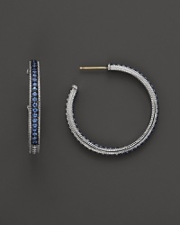 Sparkling sapphires detail a classic pair of sterling silver hoop earrings from Judith Ripka. Sparkling sapphires detail a classic pair of sterling silver hoop earrings from Judith Ripka.