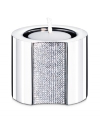 The Ambiray candle holder from Swarovski presents sleek, stainless steel heightened with dozens of tiny faceted clear crystals, creating a home accent that truly radiates glamour and sophistication. The Ambiray candle holder from Swarovski presents sleek, stainless steel heightened with dozens of tiny faceted clear crystals, creating a home accent that truly radiates glamour and sophistication.