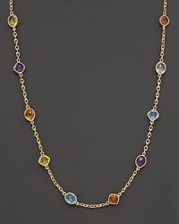 This multi gemstone necklace features colorful stone stations against a stunning 14 Kt. gold setting and chain. This multi gemstone necklace features colorful stone stations against a stunning 14 Kt. gold setting and chain.
