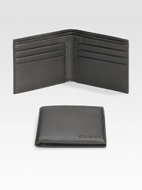A classic leather bi-fold wallet with cut-out logo detail. Two bill compartments Six card slots 4.3W X 3.5H Made in Italy A classic leather bi-fold wallet with cut-out logo detail. Two bill compartments Six card slots 4.3W X 3.5H Made in Italy