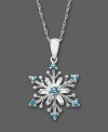 A snowflake to warm your heart on a blustery winter's day. This unique pendant features blue topaz (3/8 ct. t.w.) and white topaz (3/8 ct. t.w.) in a sterling silver setting. Approximate length: 18 inches. Approximate drop: 1 inch.