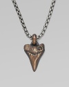 A shark's tooth pendant is handsomely craft, lending to lend a new look to any man's collection. From the Small Amulet Collection Titanium Bronze 2.7mm box chain length, 22 Lobster clasp Imported 