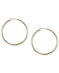 Go for big time fashion! These Anne Klein hoop earrings boast a large design and click-top closure. Crafted in gold tone mixed metal. Approximate diameter: 1-1/2 inches.
