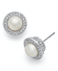 Frame your face with this signature style. Eliot Danori's elegant post stud earrings feature framed simulated pearls (7 mm) encircled by crystals and set in rhodium-plated mixed metal. Approximate diameter: 1/4 inch. Frame your face with this signature style. Eliot Danori's elegant post stud earrings feature framed simulated pearls (7 mm) encircled by crystals and set in rhodium-plated mixed metal. Approximate diameter: 1/4 inch.